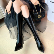 Botas altas negras de tacón