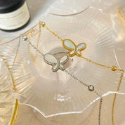 Pulsera dorada con dije de mariposa - Dressygt
