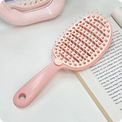 Cepillo desenredante con cubierta de limpieza fácil