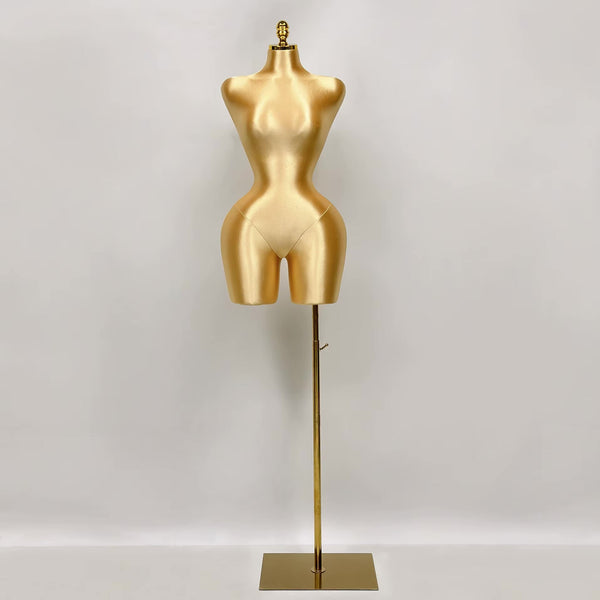 Maniquí con torso femenino dorado