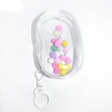 Mini bolso transparente tipo llavero