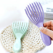 Mini cepillo desenredante flexible para cabello