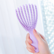 Mini cepillo desenredante flexible para cabello