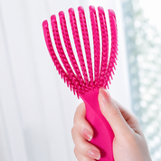 Mini cepillo desenredante flexible para cabello