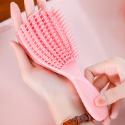 Mini cepillo desenredante flexible para cabello