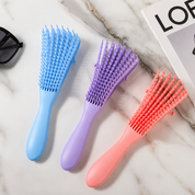 Cepillo desenredante flexible para cabello