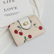 Billetera tipo coach con broche