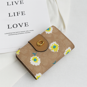 Billetera tipo coach con broche