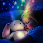 Conejo de peluche con luz nocturna y música