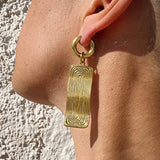 Aretes colgante dorados rectangular