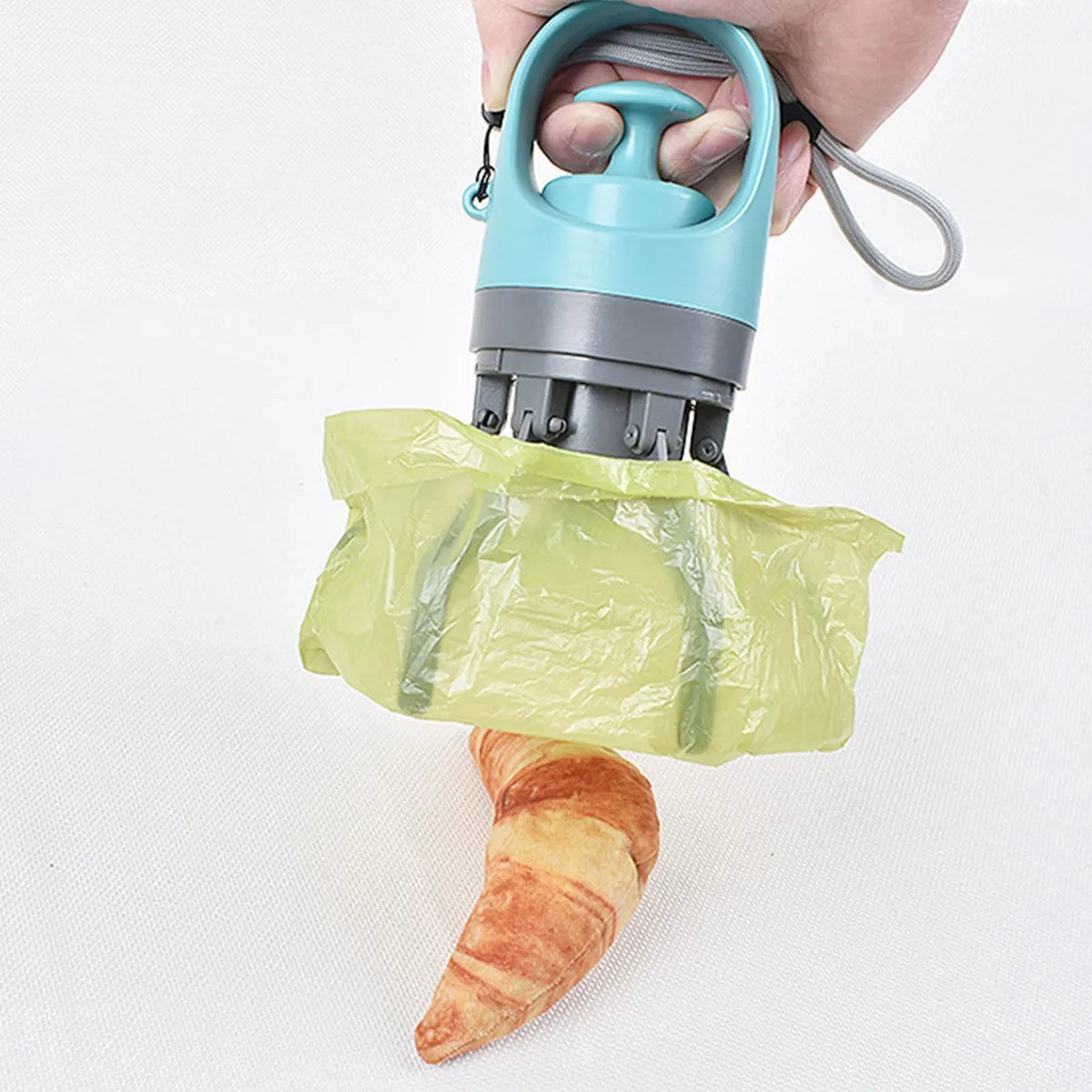 Recogedor con agarrador para desechos de mascotas