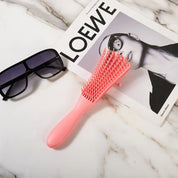 Cepillo desenredante flexible para cabello