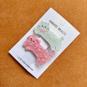 Set de 2 ganchos para cabello con diseño de mascotas