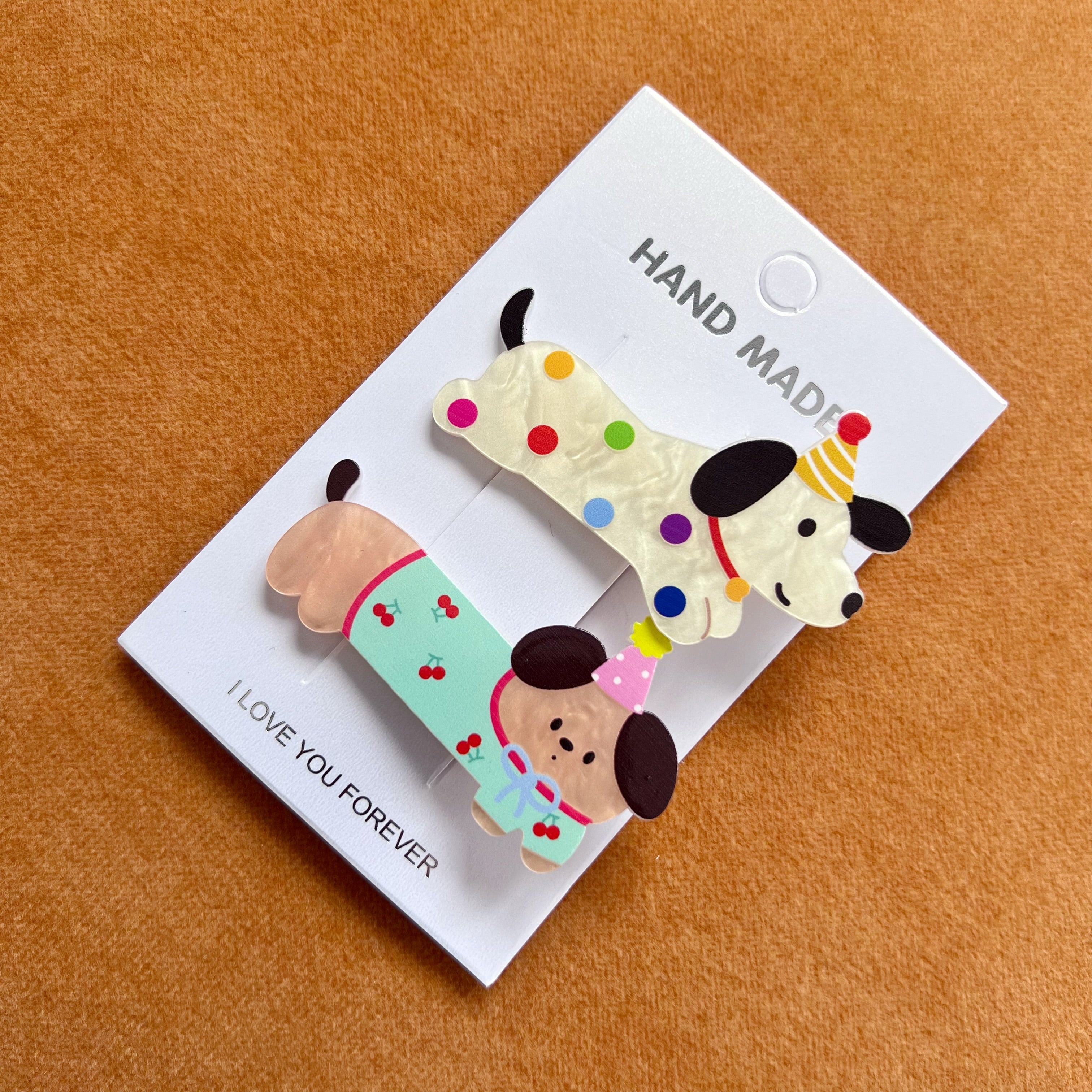 Set de 2 ganchos para cabello con diseño de mascotas