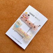 Set de 2 ganchos para cabello con diseño de mascotas