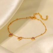 Pulsera dorada con dijes rosas - Dressygt
