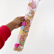 Docena de colas de hello kitty, capibara y stitch