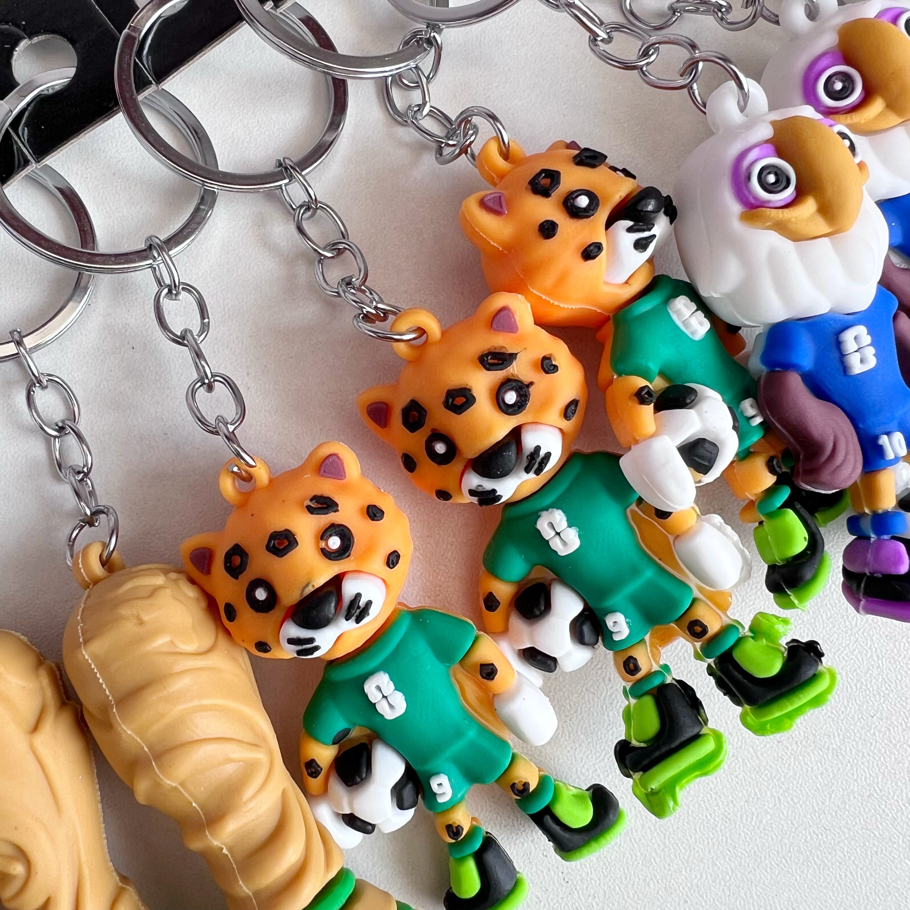 Docena de llaveros de mascotas mundialistas - Dressygt