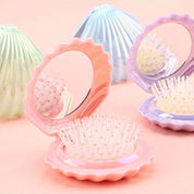 Mini peine plegable tipo concha con espejo