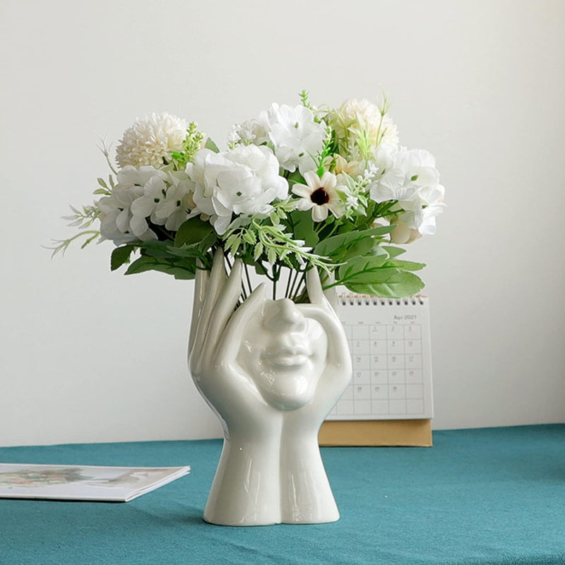 Florero con diseño de rostro