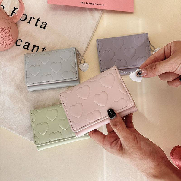 Billetera con diseños de corazones