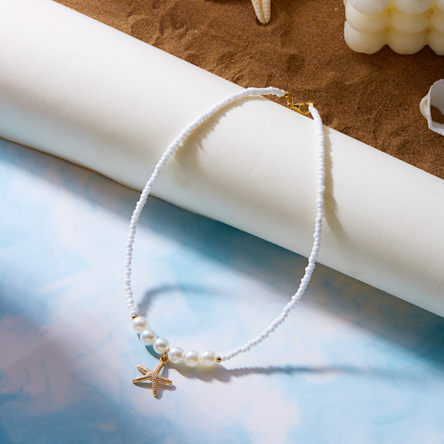 Collar con perlas y estrella de mar