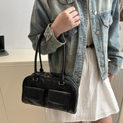 Bolso con bolsas al frente