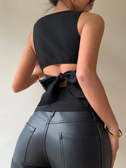 Blusa sin mangas con moño en la espalda