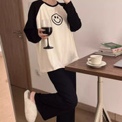Pijama de 2 piezas de manga larga con carita feliz