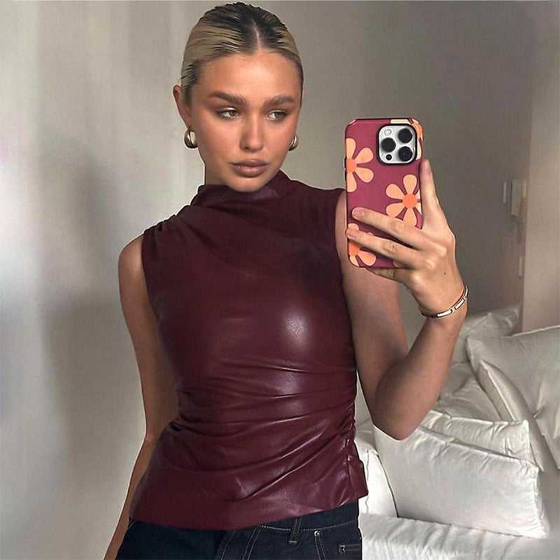 Blusa asimétrica sin mangas con cuello alto estilo cuerina