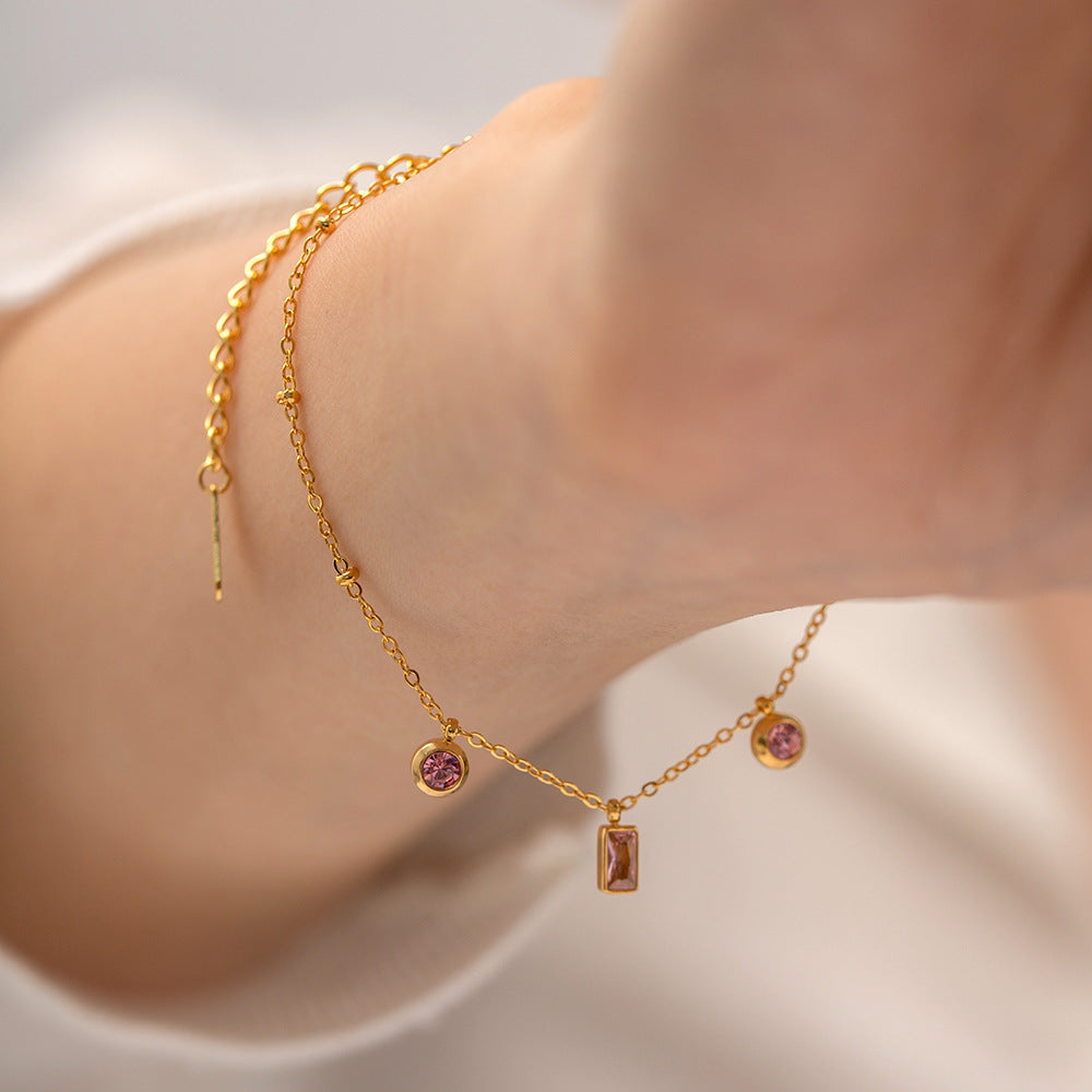 Pulsera dorada con dijes rosas - Dressygt