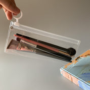 Cosmetiquera plástica transparente con zipper