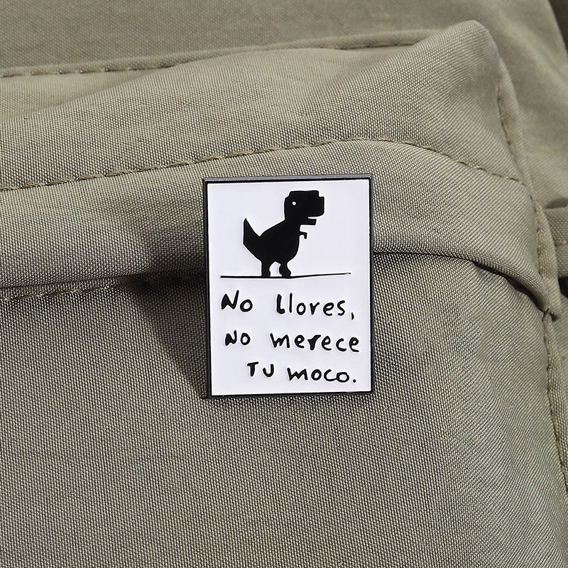 Pin decorativo de dinosaurio con frase