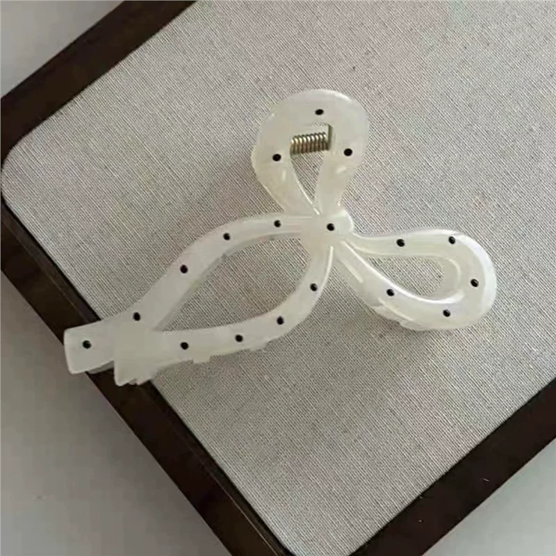 Gancho en forma de moña con puntos - Dressygt