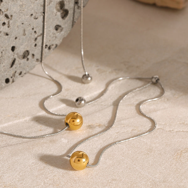 Pulsera con dije de esfera