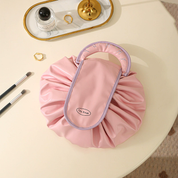 Cosmetiquera plegable con cierre ajustable