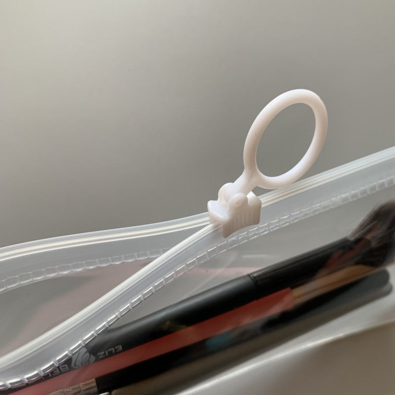 Cosmetiquera plástica transparente con zipper