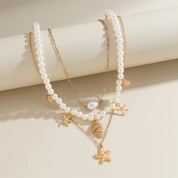 Collar multicapa de perlas con dijes marinos - Dressygt