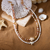 Collar doble con estrella de mar y tortuga