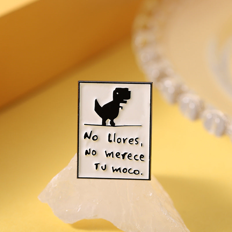 Pin decorativo de dinosaurio con frase