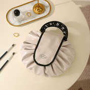 Cosmetiquera plegable con cierre ajustable