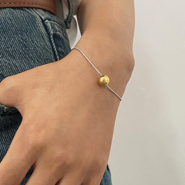 Pulsera con dije de esfera