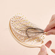 Cepillo desenredante con cubierta de limpieza fácil