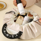 Cosmetiquera plegable con cierre ajustable