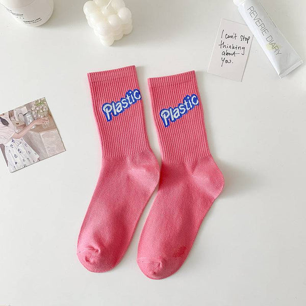 Calcetas altas rosadas con estampados girly