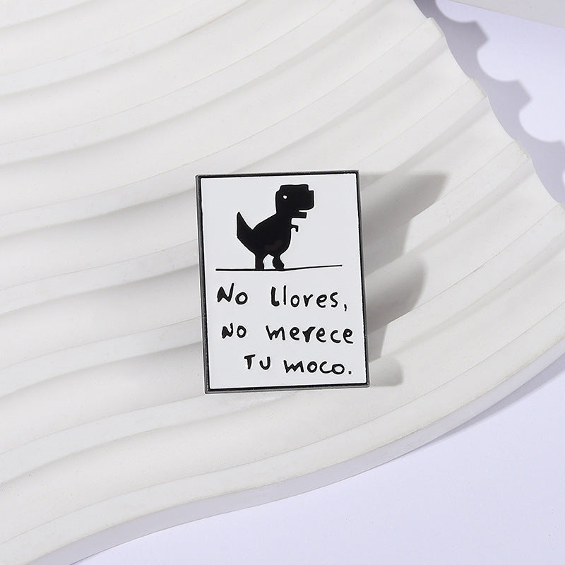 Pin decorativo de dinosaurio con frase