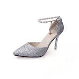 Zapatos de tacón con punta y perlas