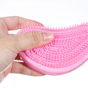 Cepillo desenredante ergonómico