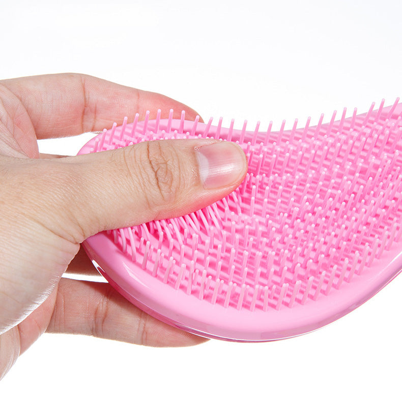 Cepillo desenredante ergonómico