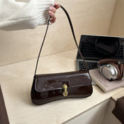 Bolsa de hombro efecto charol